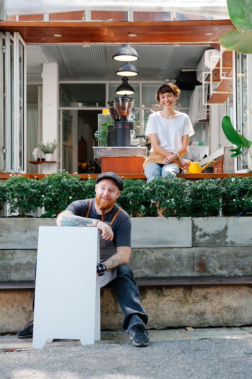 Cheerful couple on terrace of cafe