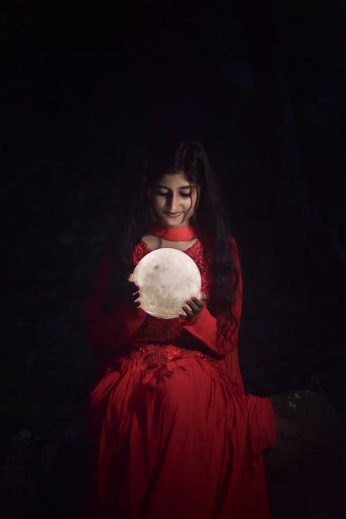 Woman in Red Dress Holding Moon Model