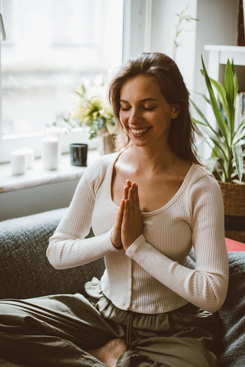 Woman Smiling While Meditating