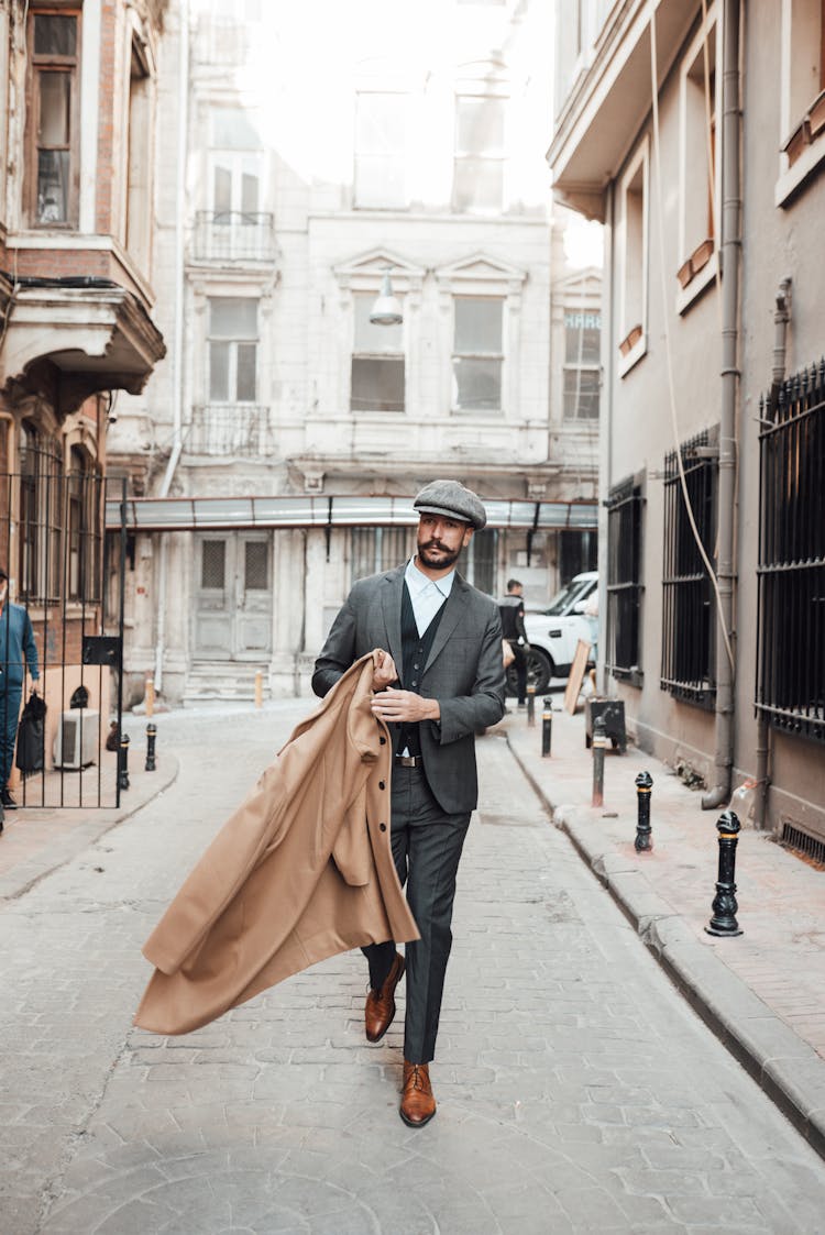 Stylish Man Walking On Street In Old City District