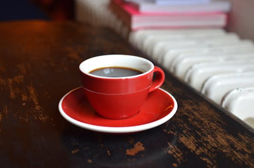 Free Coffee cup on table near radiator Stock Photo