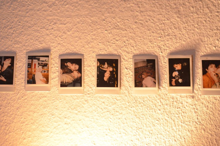 Collection Of Printed Photos On Wall