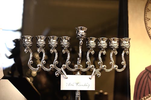 Candelabra made of silver material and With Friendship title on tag during Hanukkah festival