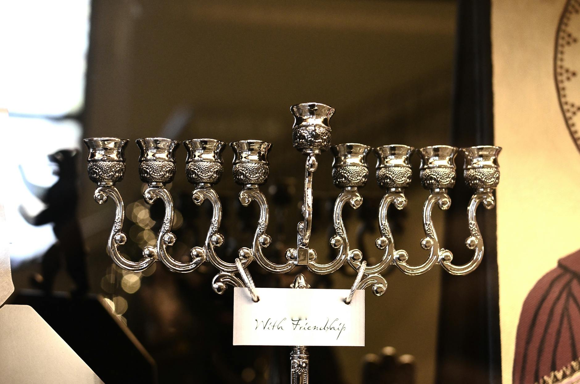 Candelabra made of silver material and With Friendship title on tag during Hanukkah festival