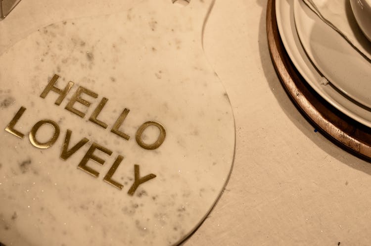 Cutting Board With Hello Lovely Inscription On Served Table