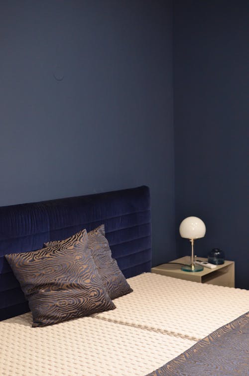 Modern bedroom interior with pillows in hotel room