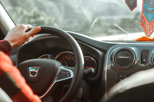 Free A Person Driving a Car Stock Photo