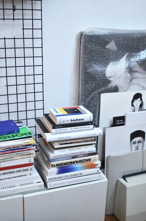 Stack of Books on White Desk