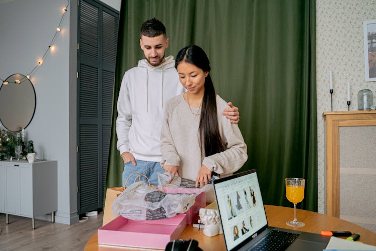 Man And Woman Opening Box