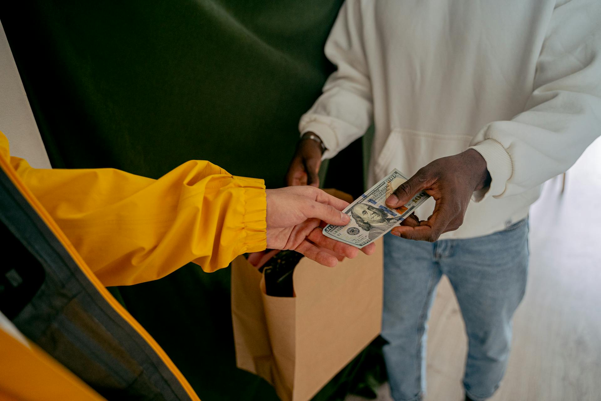 Close up of a Person Paying in Cash