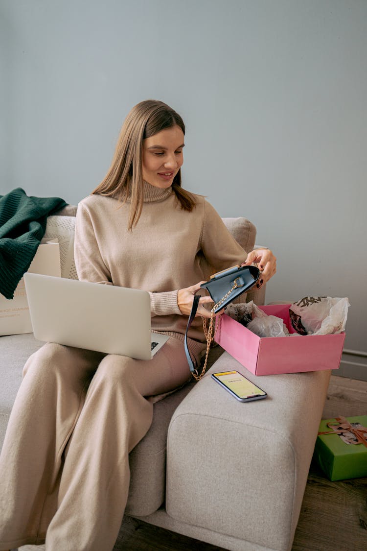 Woman Unpacking New Handbag