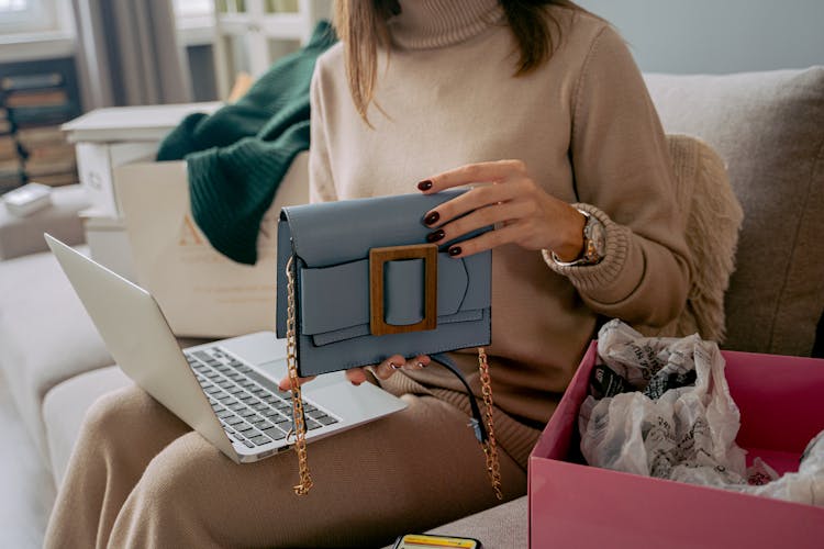 Woman Holding A Brand New Purse 