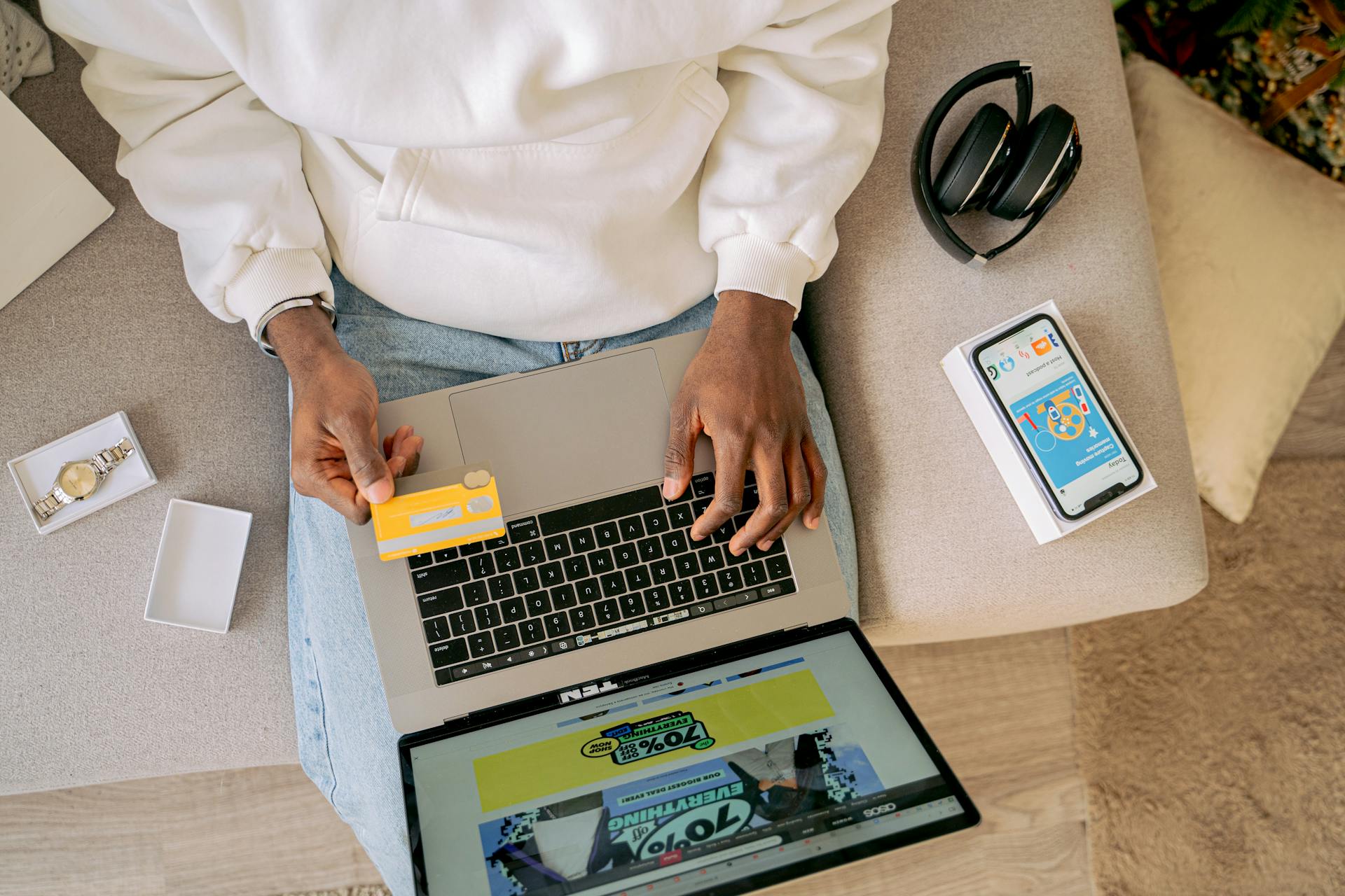 Woman Sitting on a Couch and Online Shopping