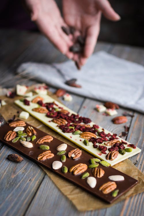 Free Handmade Chocolate Bars with Nuts on Top Stock Photo