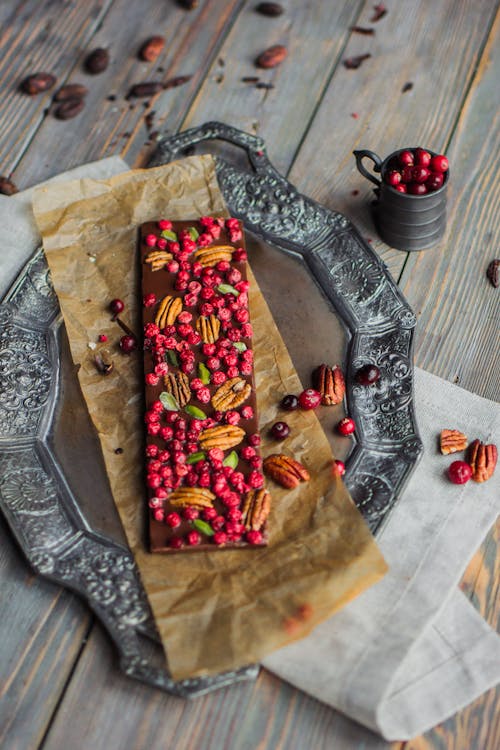 Free Handmade Chocolate Bar with Nuts and Fruit on Top Stock Photo