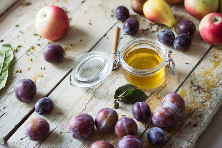 Plumes, Apples And Honey In Jar