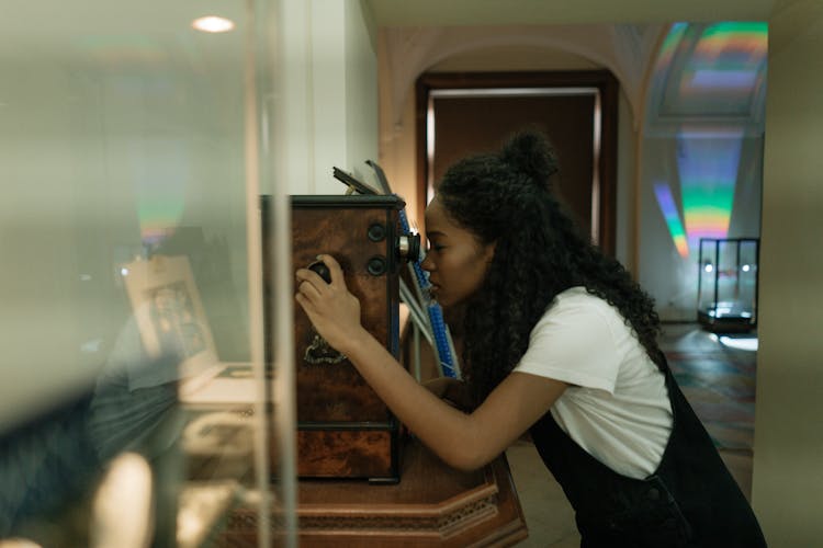 A Student Looking Through The Telescope