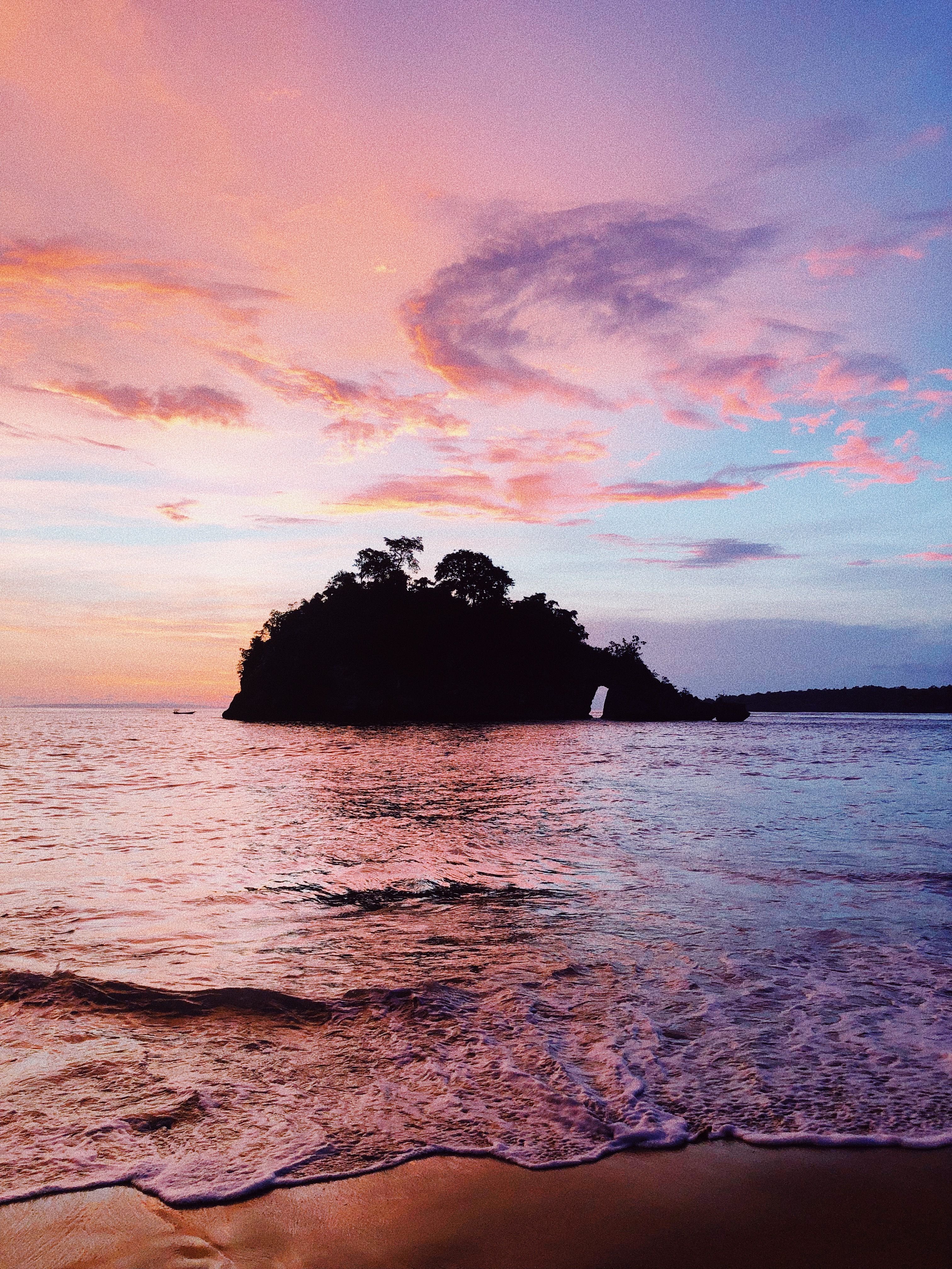 Silhouette of an Island during Sunset · Free Stock Photo