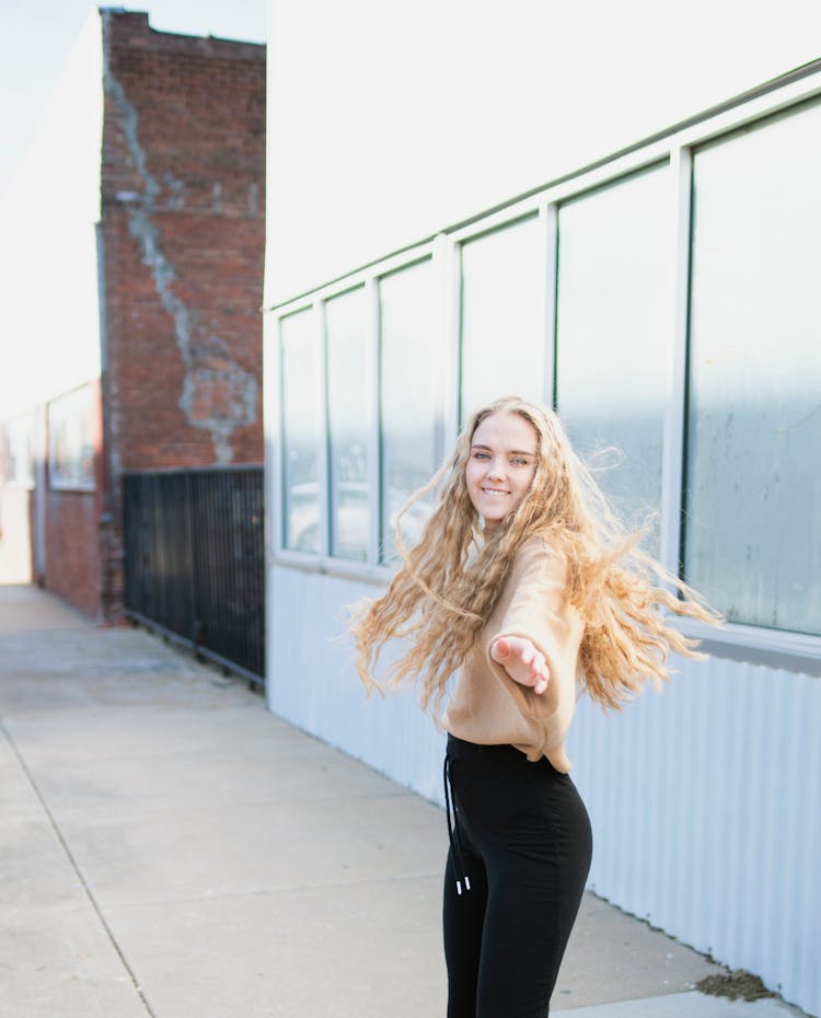 Blonde Woman Standing In The Open