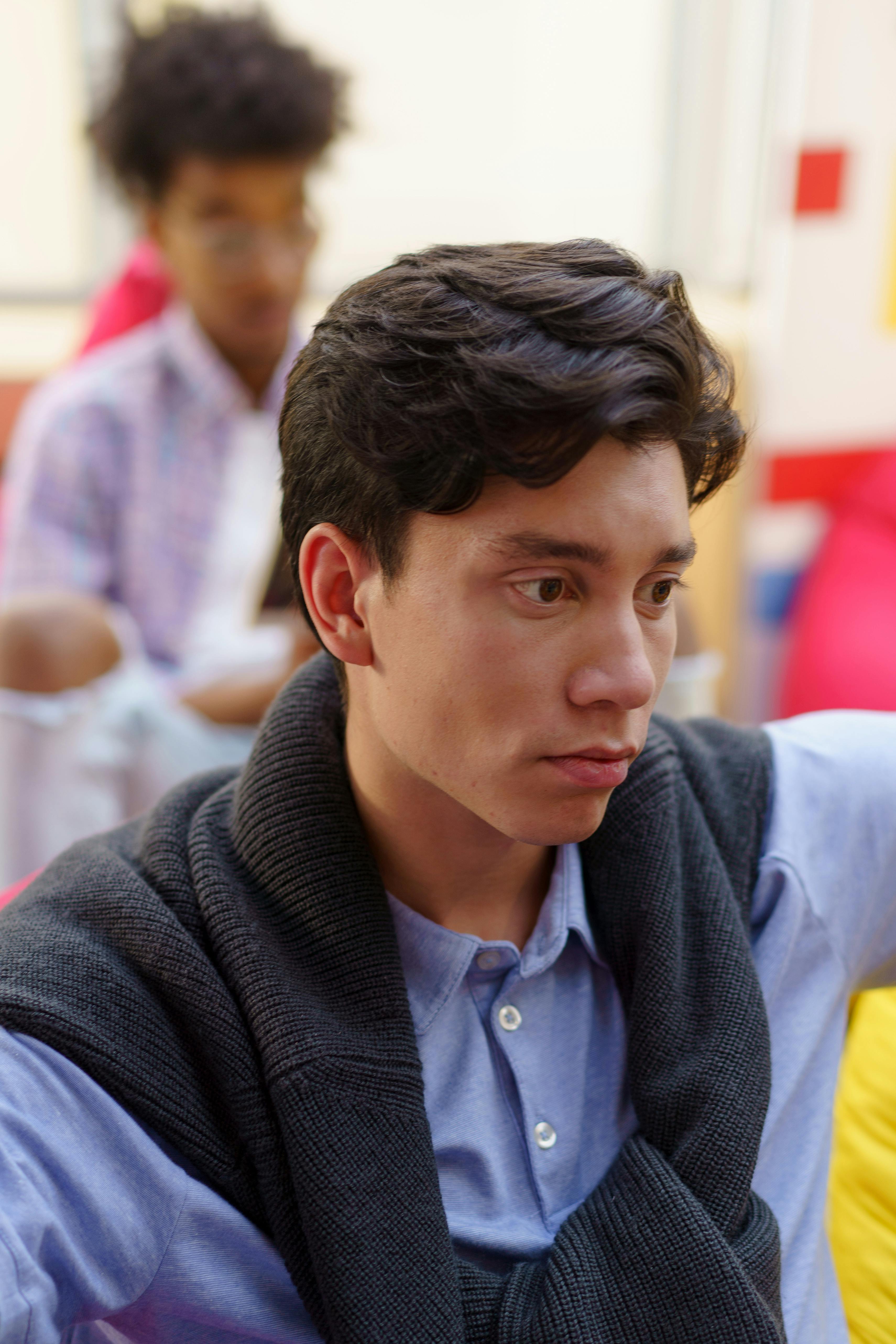 Download A Young Man With A White Shirt And Black Hair