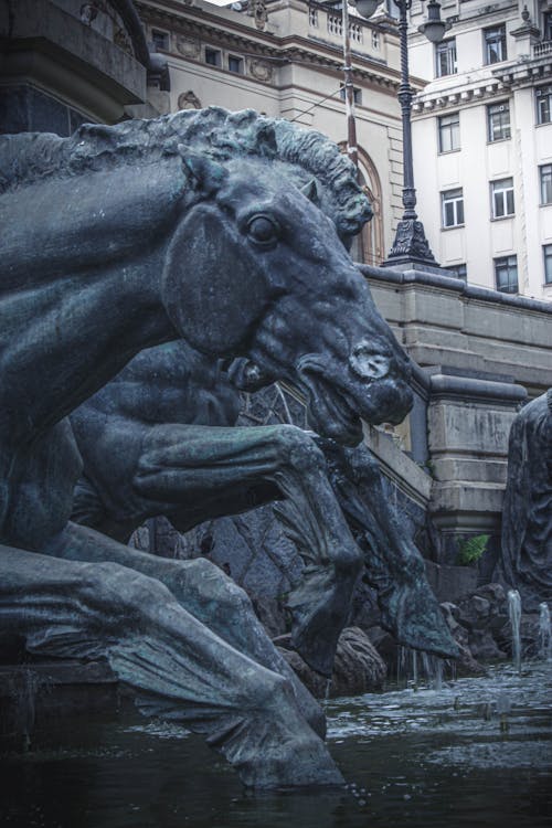 Fountain with old sculptures of horses