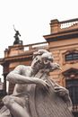 Old marble sculpture of musician with instrument