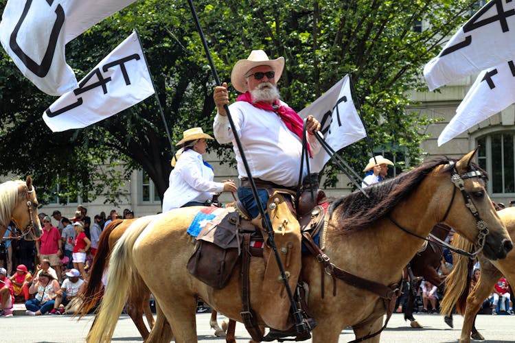 Cowboy Riding Horse On City Parade