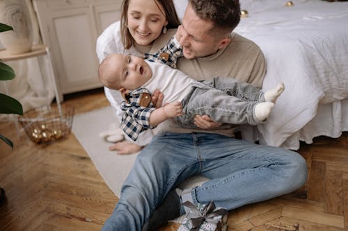 Free Parents Looking at Their Cute Son Stock Photo