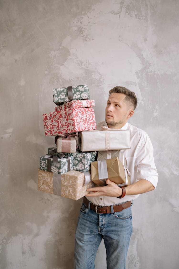 Man Carrying Gift Boxes