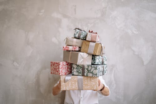 Free Boxes of Gifts Carried by a Man Stock Photo