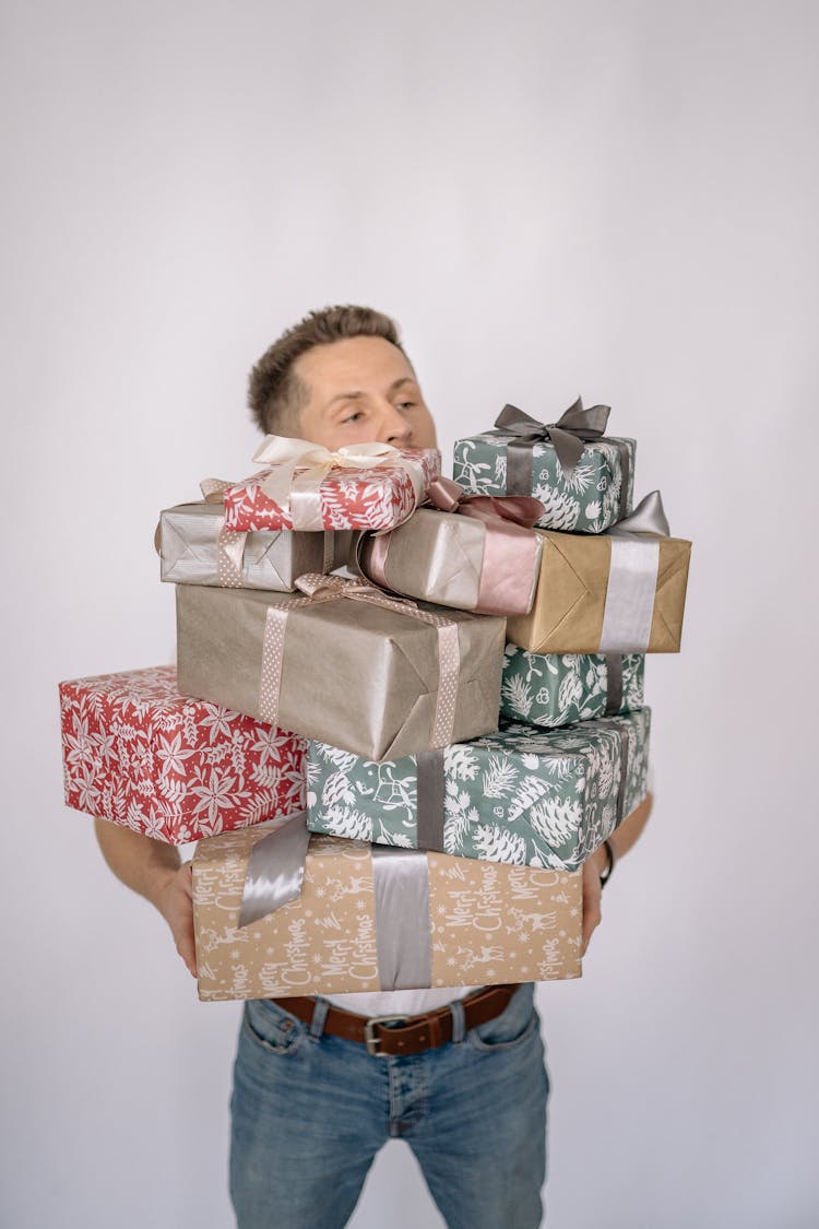 Man Carrying Gift Boxes