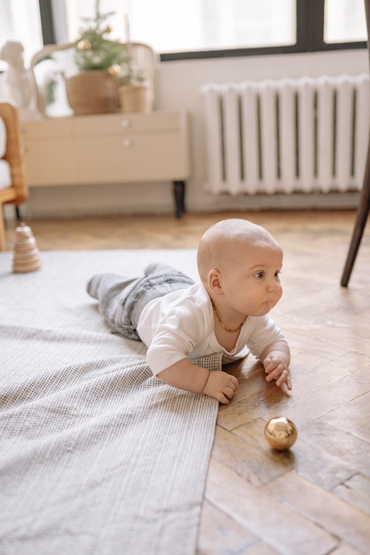 Baby Boy Crawling On The Floor