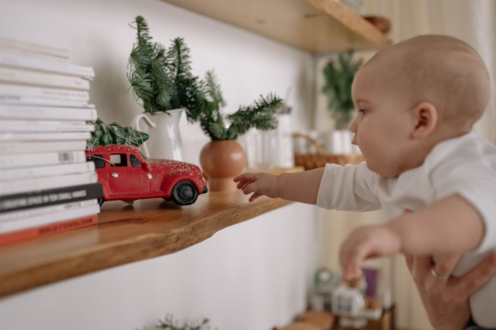 infant reaching for toy