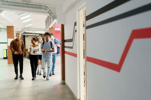 Free Students Walking in the Hallway Stock Photo
