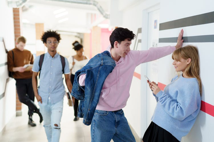 Young Man Flirting With A Young Woman