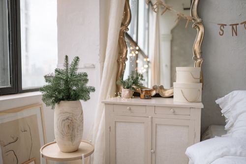 Free Warm and inviting bedroom with elegant decor and natural elements, perfect for relaxation. Stock Photo