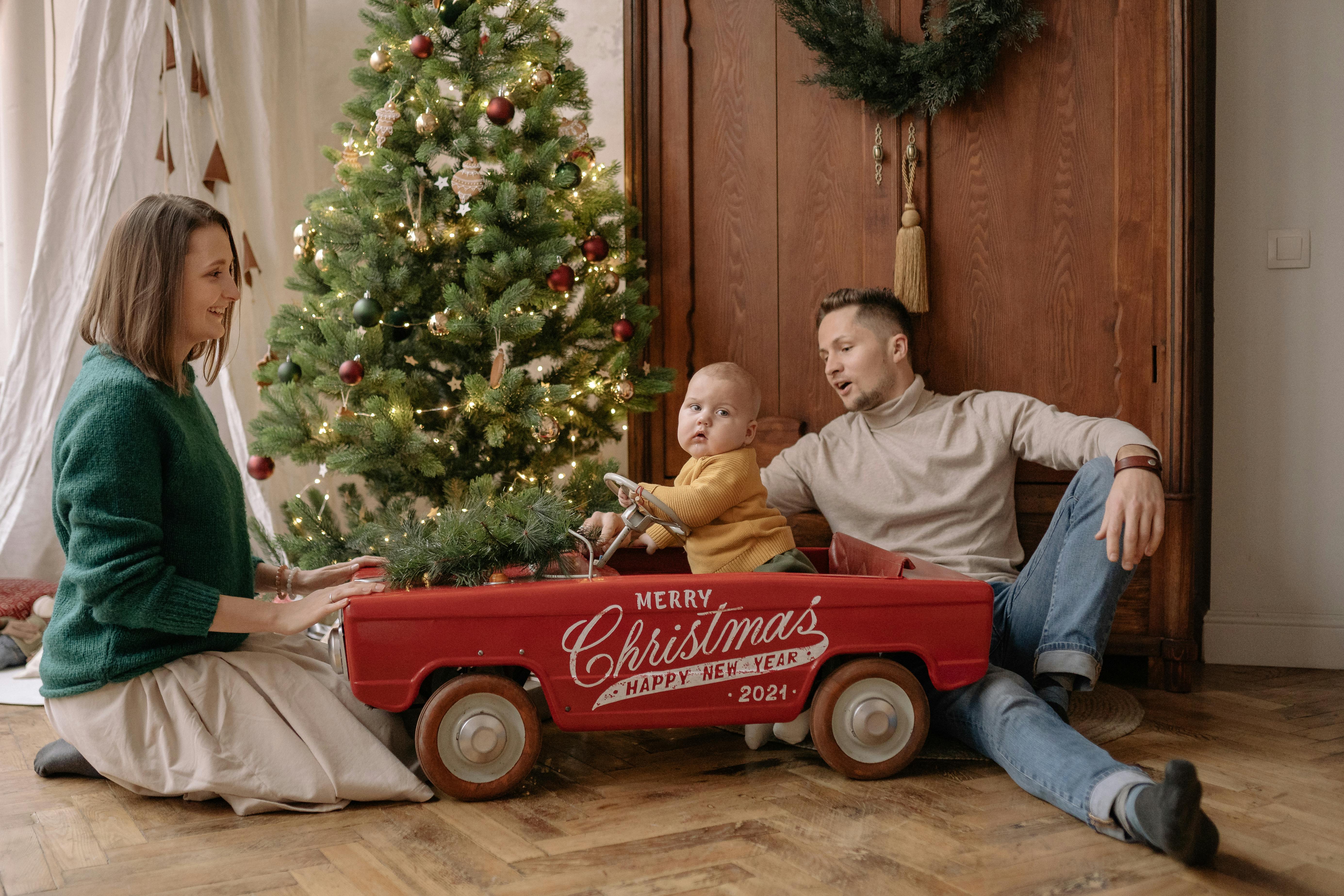 family in living room at christmas time