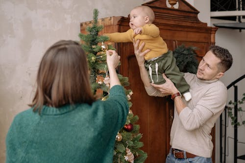 Family Decorating a Christmas Tree