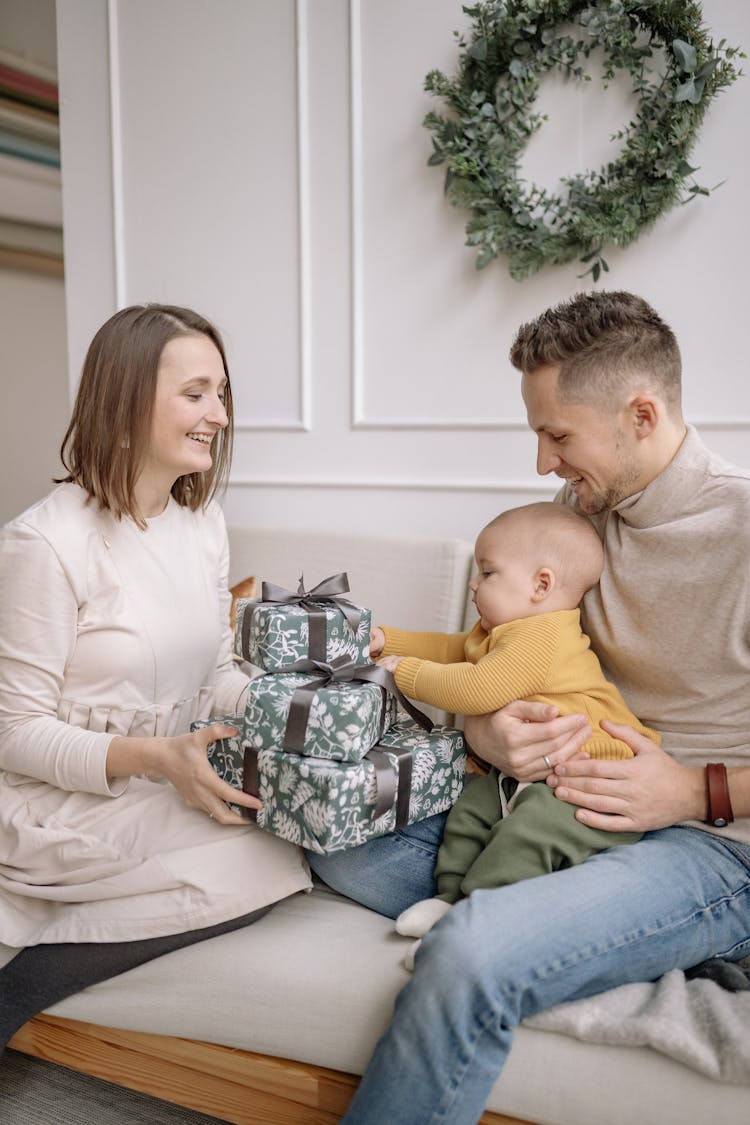 Happy Family With Christmas Gifts