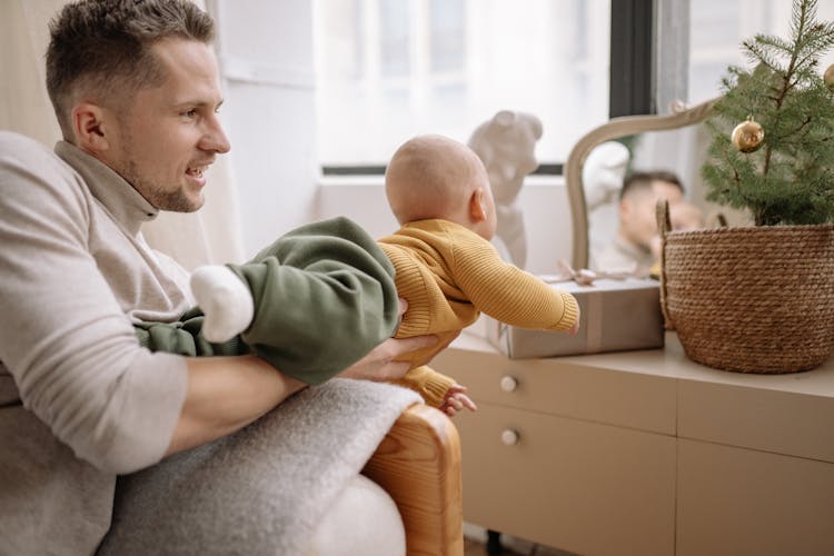 Man With Baby Boy During Christmas Time 