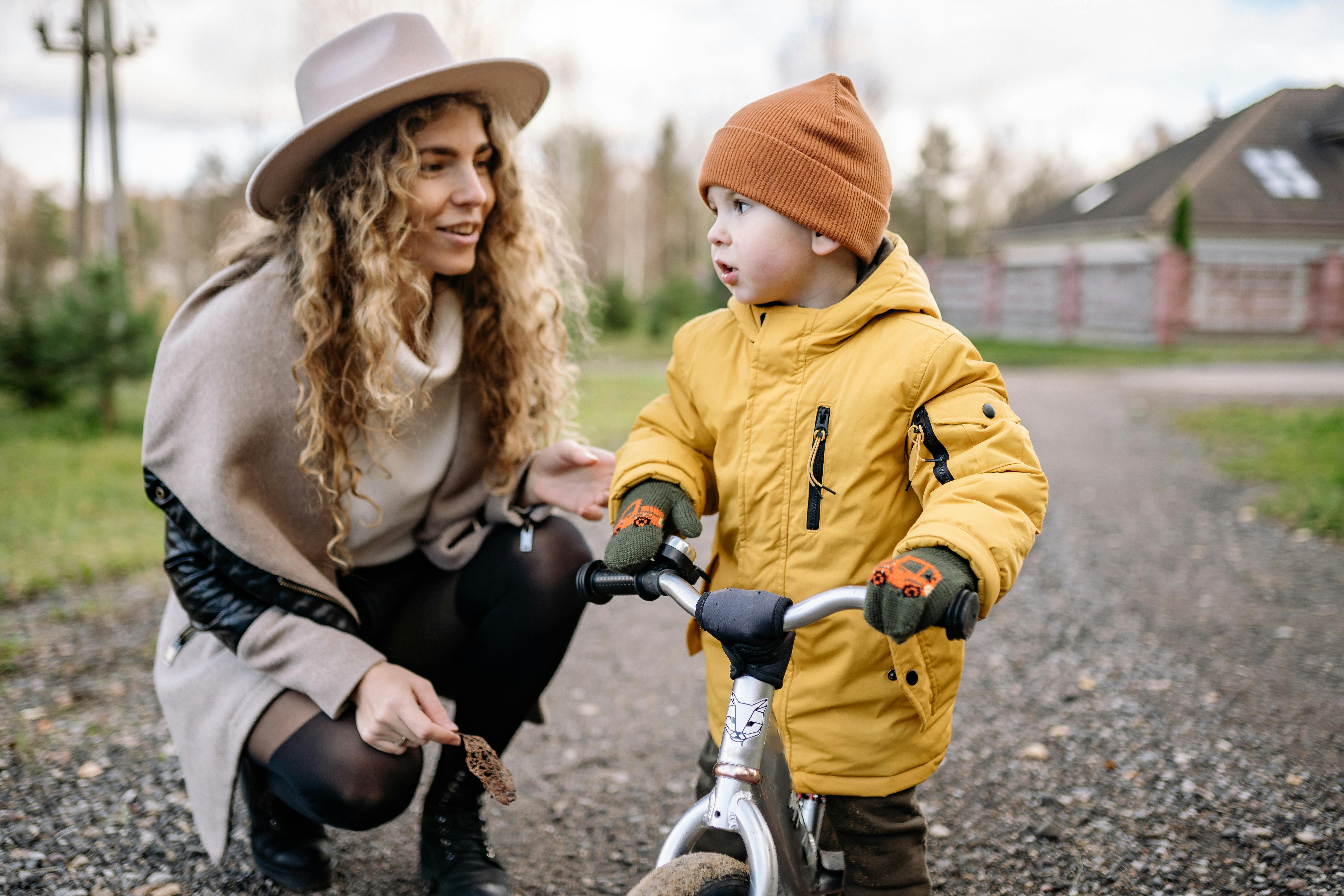 Mother with a Toddler on a Bicycle · Free Stock Photo