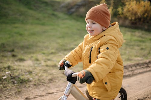 A Child Riding a Bicycle