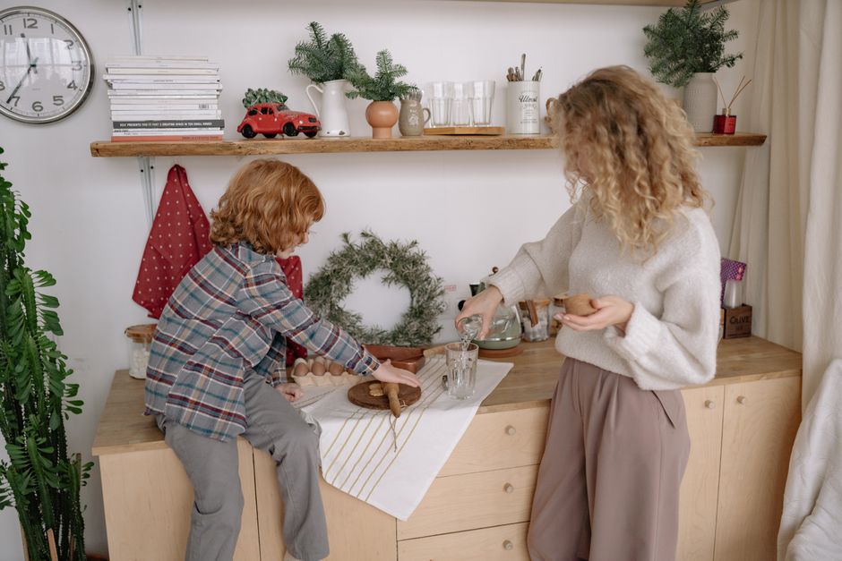 A cozy scene of a mother and child baking, surrounded by kitchen decor. Perfect for family lifestyle themes. A cozy scene of a mother and child baking, surrounded by kitchen decor. Perfect for family lifestyle themes.