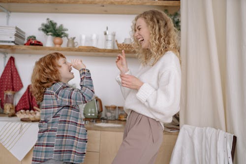 Free A Happy Woman and her Son in a Kitchen Stock Photo