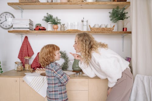 Free A Woman with her Son in the Kitchen Stock Photo