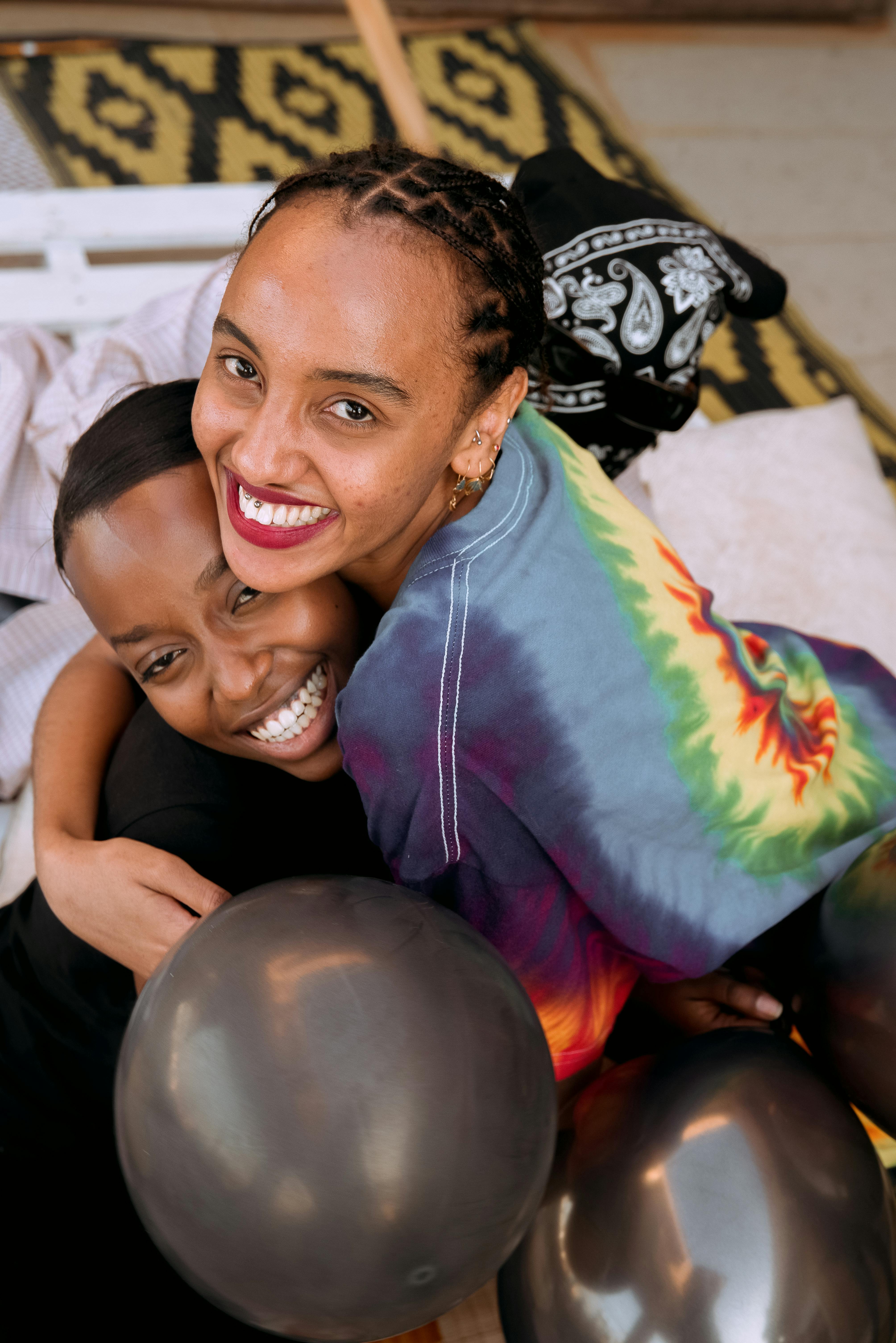 a happy woman hugging her friend