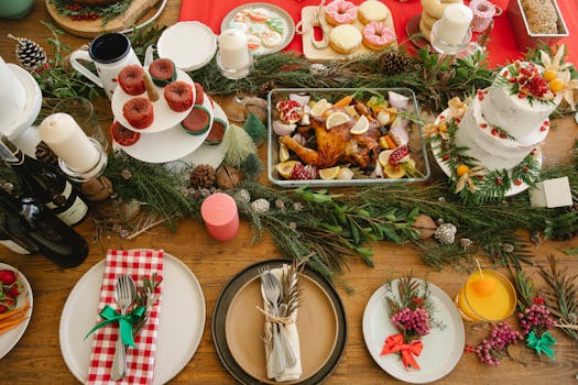 A festive table setting featuring a holiday feast with Christmas decorations and delicious treats, ideal for celebrations.