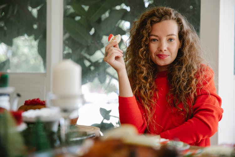 Content Woman With Cookie In Hand