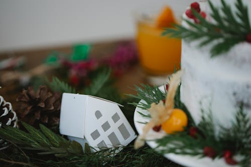 Christmas party favour candy box on decorated table with fir tree twigs