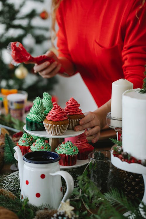 Faceless chef with homemade cupcakes on Christmas day